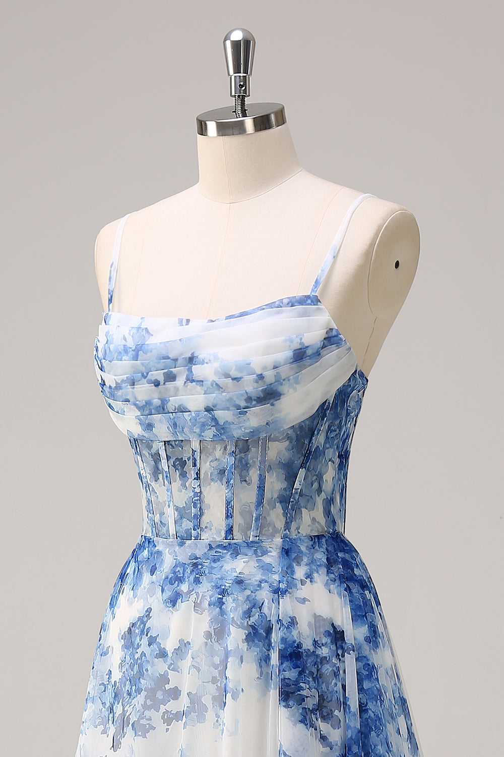 Robe longue blanche à fleurs bleues avec corset, fente et bretelles fines