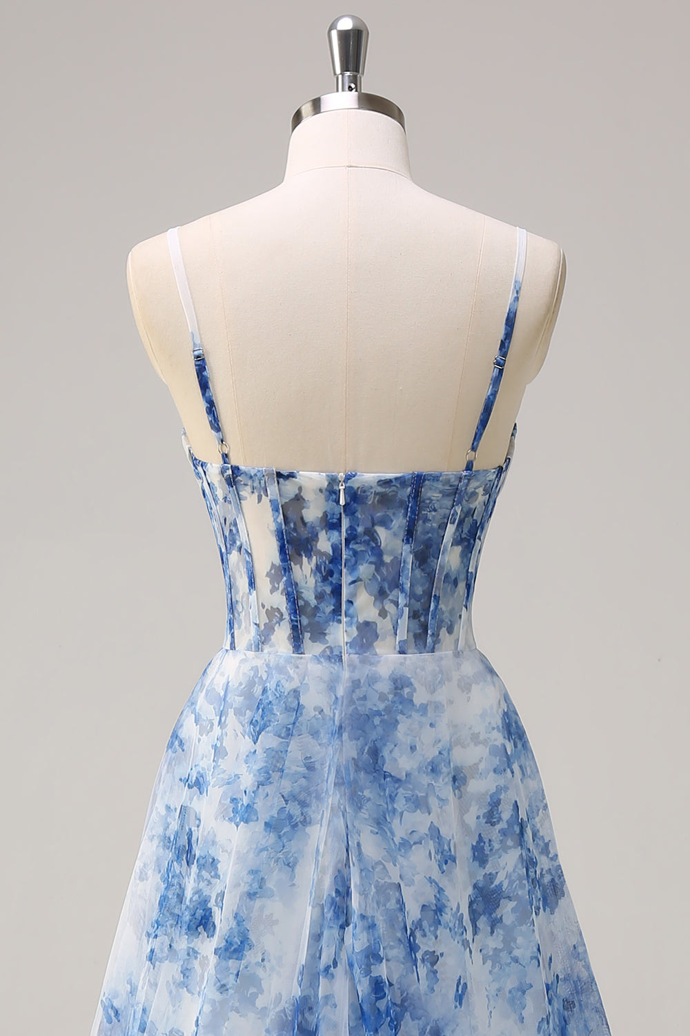 Robe longue blanche à fleurs bleues avec corset, fente et bretelles fines