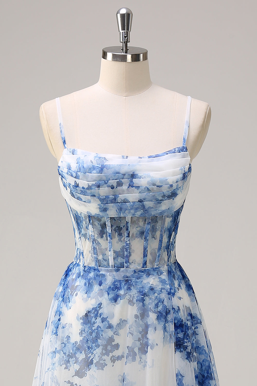 Robe longue blanche à fleurs bleues avec corset, fente et bretelles fines